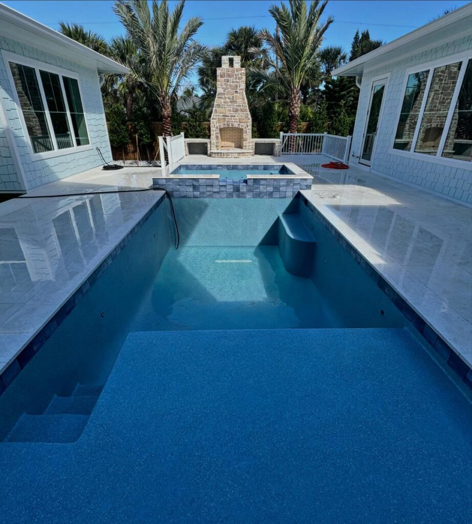 A clean swimming pool with clear water, showcasing effective pool wash calcium removal for maintenance.